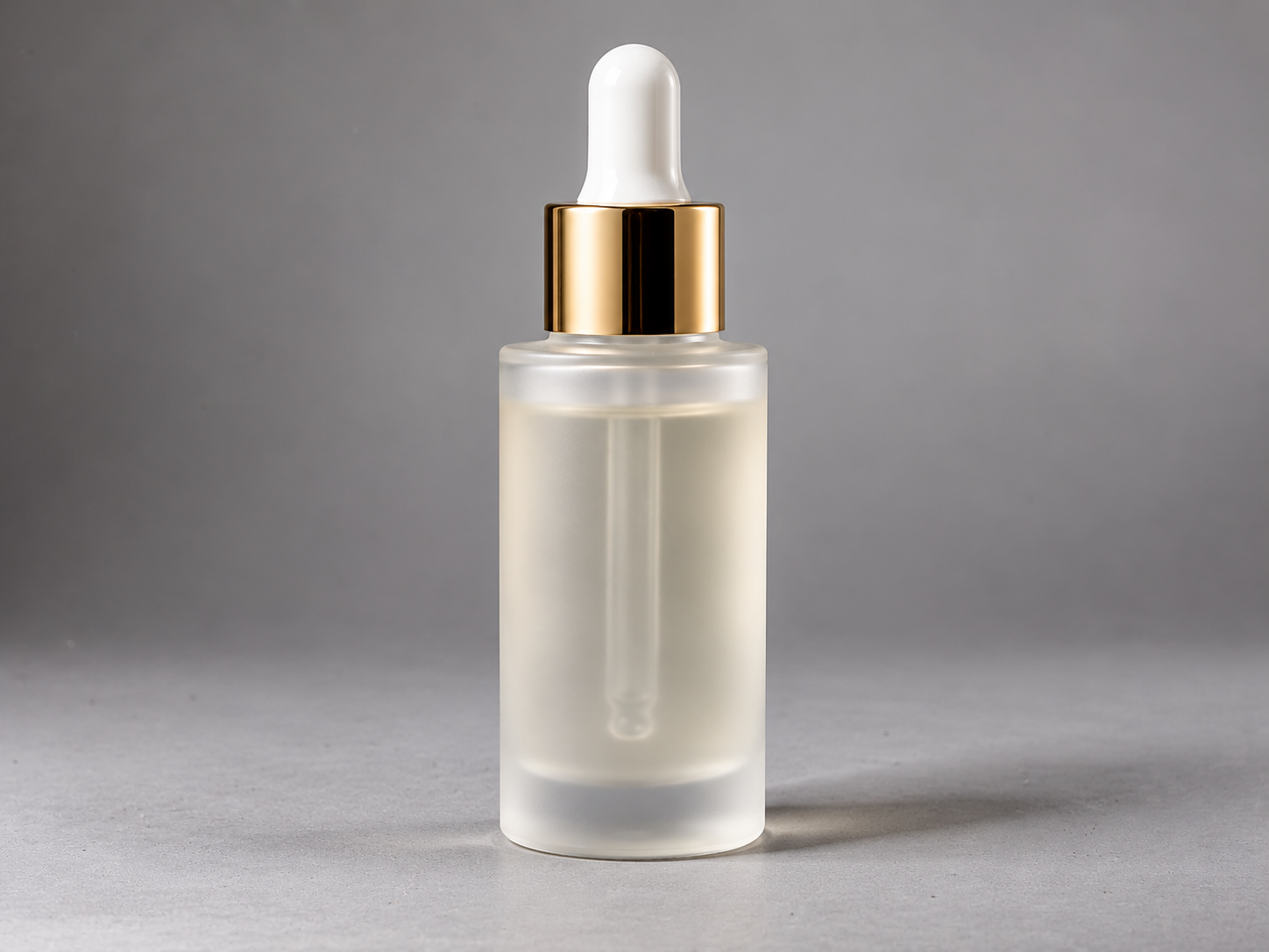 Cosmetic serum dropper bottle on pure white background